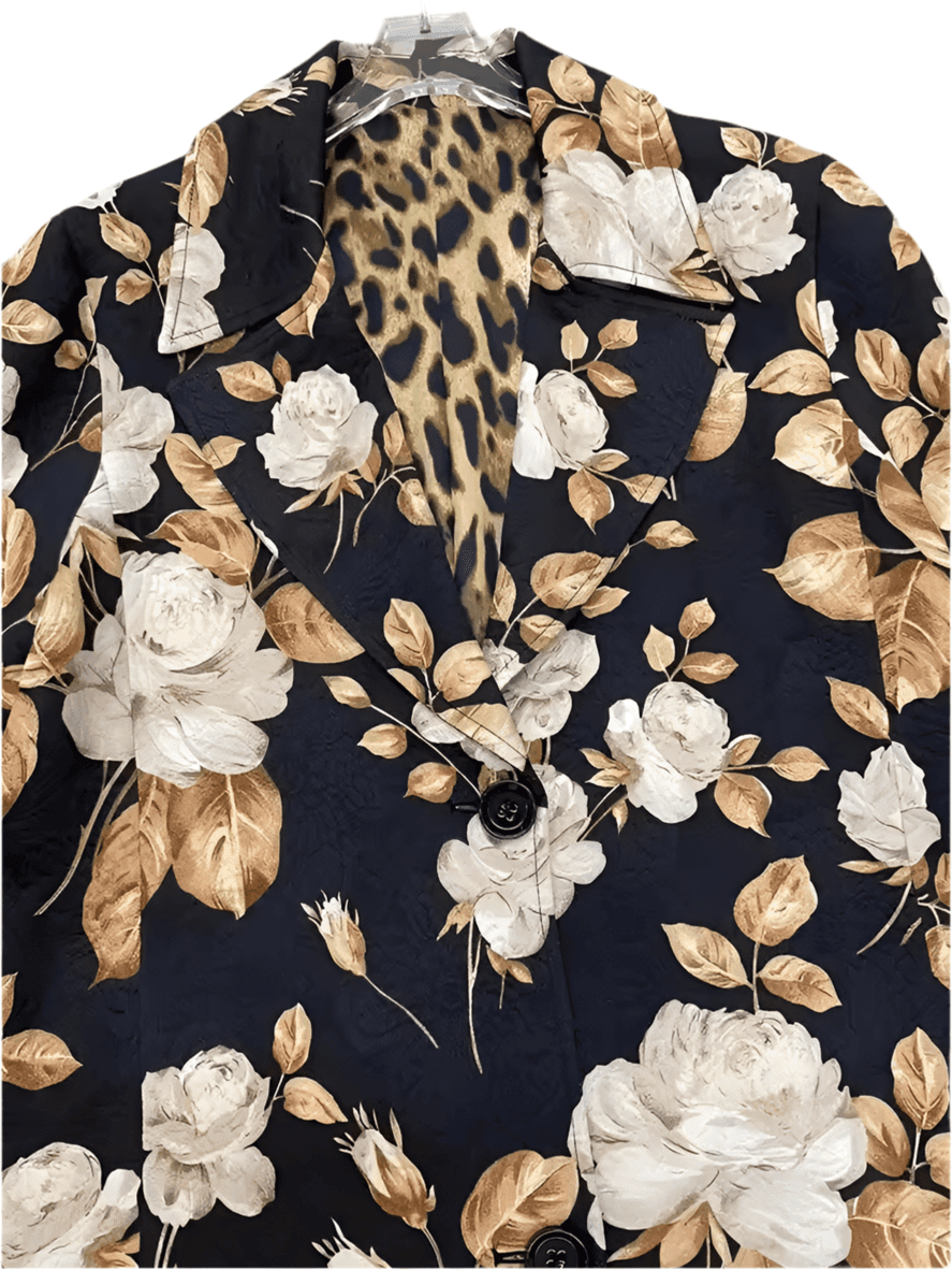 Long brocade overcoat featuring a black background with beige and white rose print and a leopard print lining.