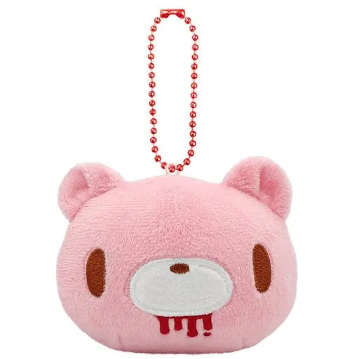 Pink plush Gloomy Bear keychain with embroidered brown features and a red stitched mouth accent, on a red ball chain.