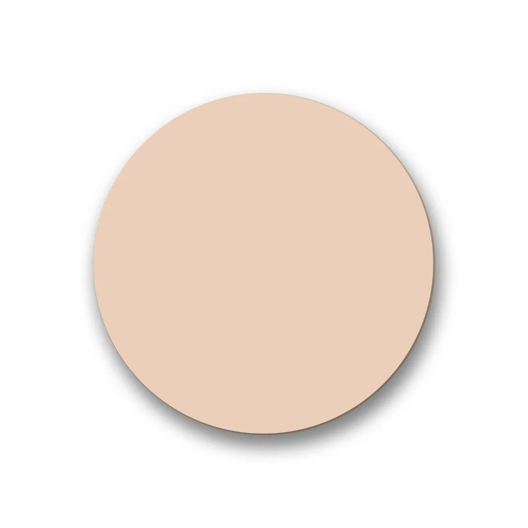 A smooth, matte, light beige circular swatch representing a makeup foundation or concealer shade.