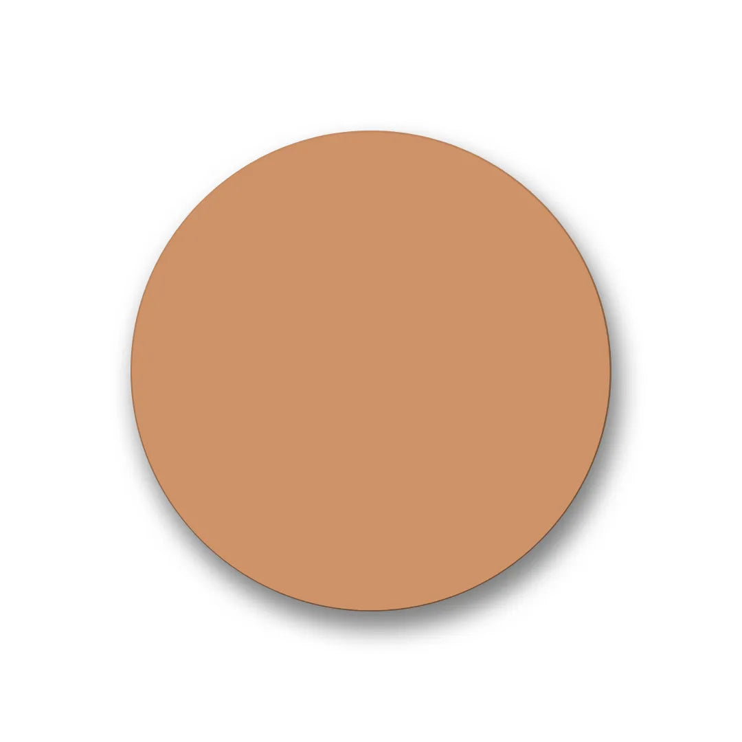 A smooth, circular swatch of light tan-toned skin care foundation or concealer on a plain white background.