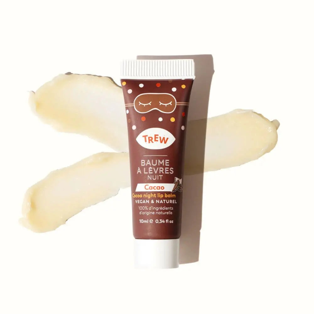 Cocoa-scented lip balm tube in brown, featuring a sleep mask icon, with a smudge of cream balm behind it.