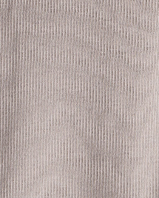 Conjunto tres piezas chaleco con oso, body y pantalón marfil