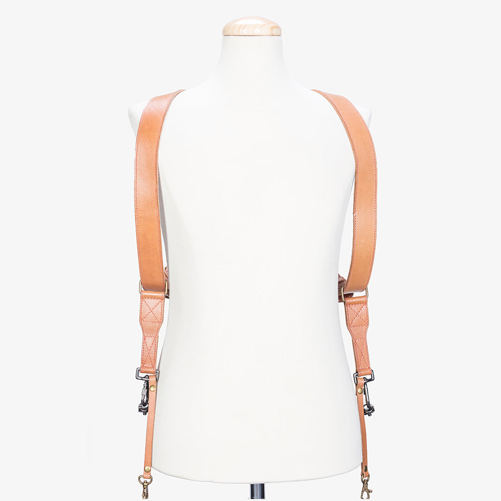 Handmade dual leather camera strap showcasing the back design on a mannequin, highlighting premium quality and craftsmanship.