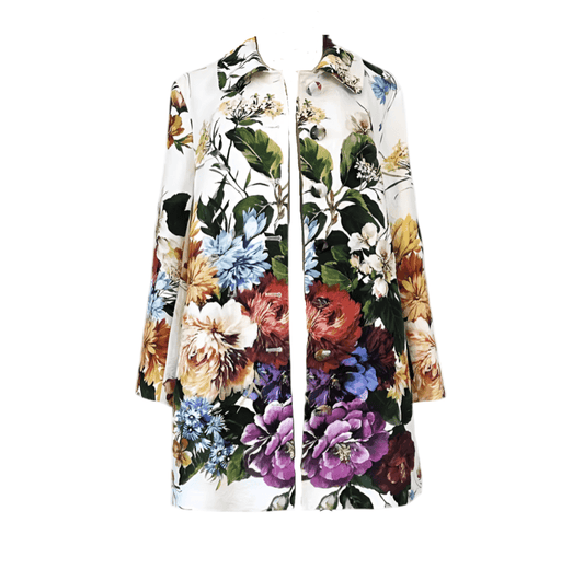 White long-sleeve brocade overcoat featuring a vibrant, multicolored floral print and a button-front closure.