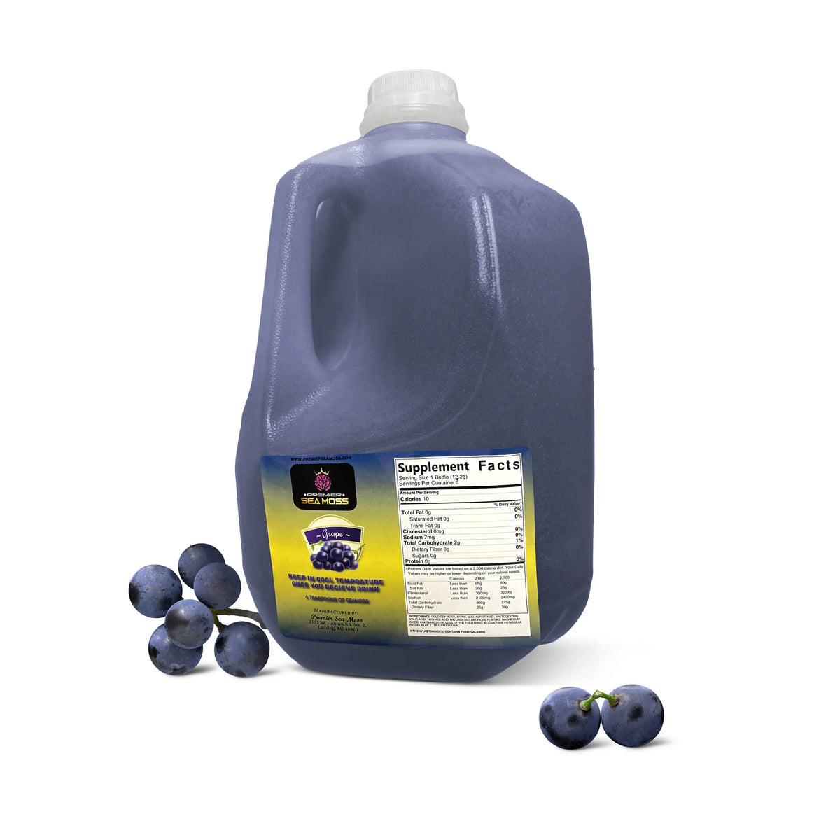 A gallon jug of purple grape-flavored sea moss with a supplement facts label and scattered fresh grapes.