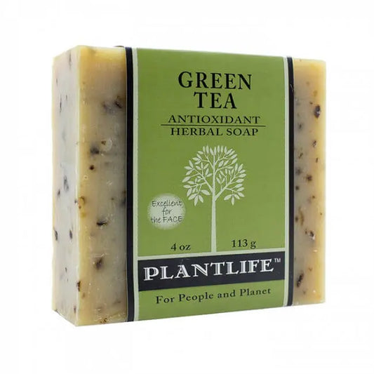 Rectangular Green Tea bar soap with herbal flecks, wrapped in a green paper label featuring a white tree illustration.