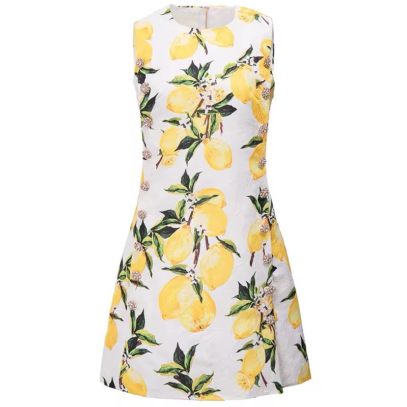 White sleeveless dress with vibrant yellow lemon print, perfect for summer outings and casual wear.