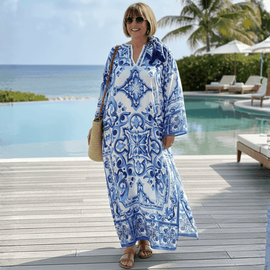 Blue and white patterned maxi dress with a loose fit, perfect for beach outings or summer vacations.