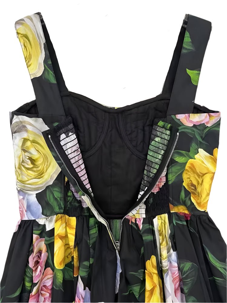 Black floral dress with yellow and pink roses, zip closure, and smocked back detail. Elegant summer style.