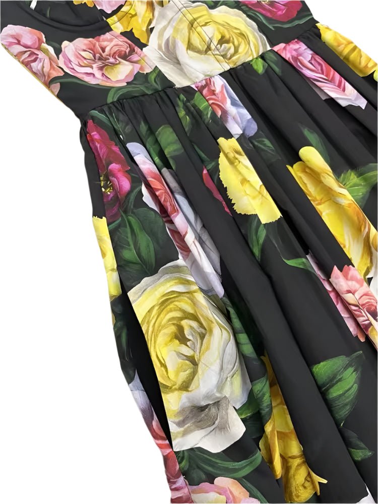 Floral cotton dress featuring vibrant yellow, pink, and white roses on a dark background, perfect for summer outings.