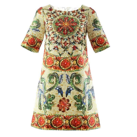 Colorful printed shift dress with short sleeves, featuring intricate floral patterns in red, green, and blue on a cream background.
