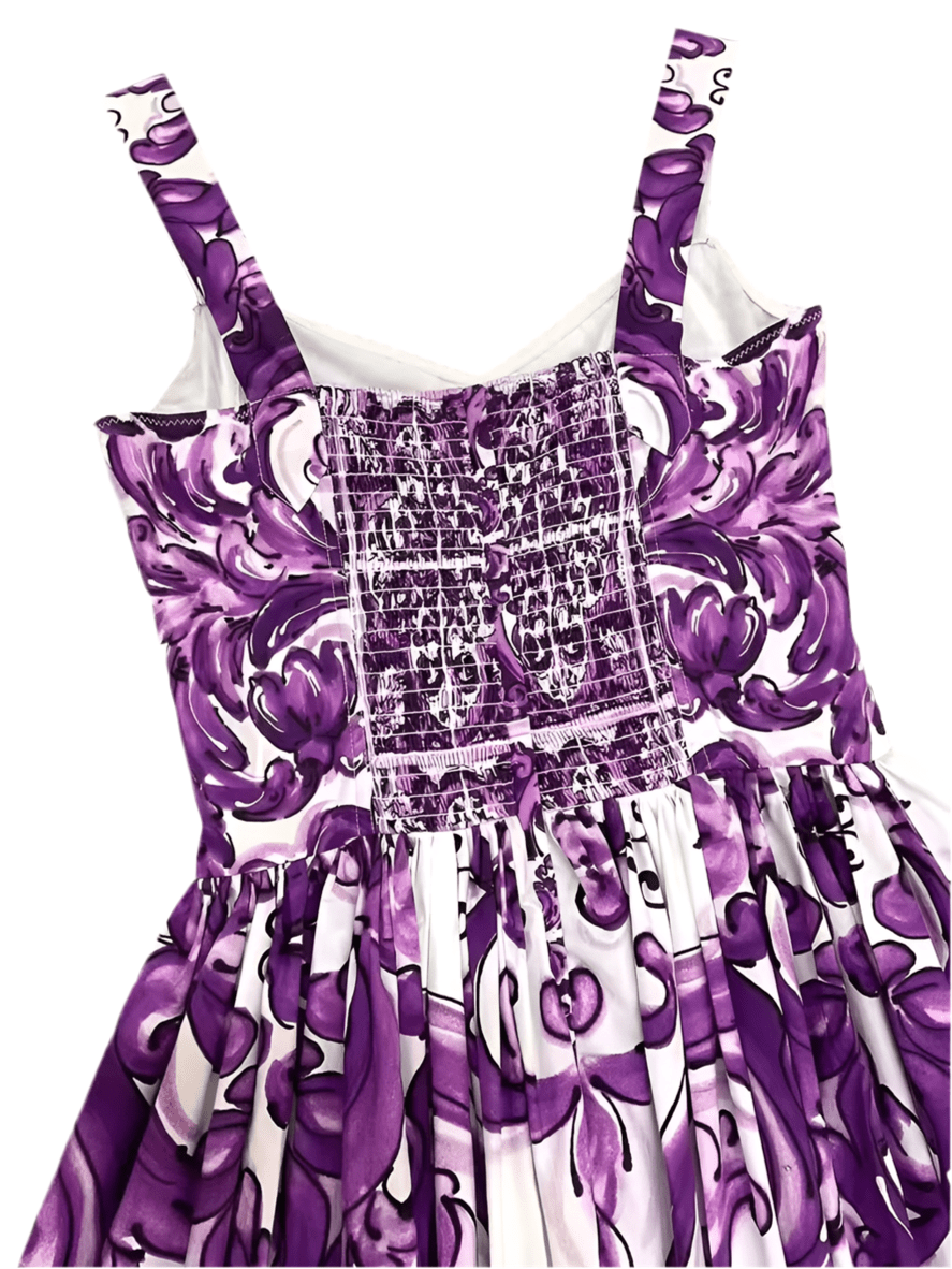 Purple floral print dress with smocked bodice and adjustable straps, perfect for summer outings.