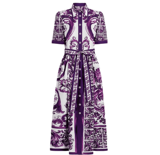 Purple and white patterned midi dress with short sleeves and belted waist. Crafted from lightweight fabric.