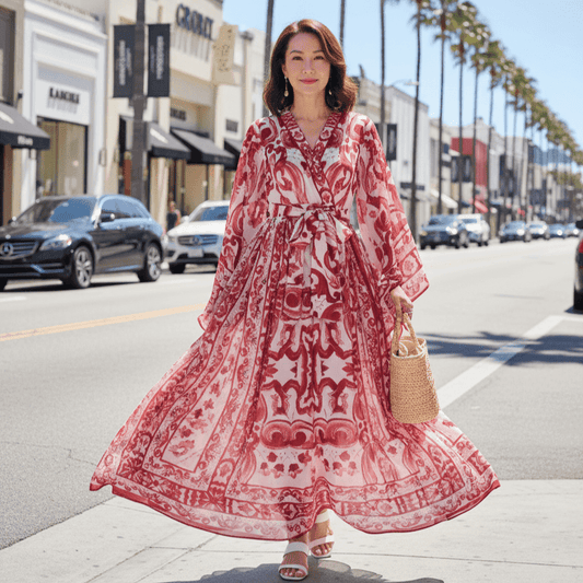 Red and white floral maxi dress in flowy chiffon with long sleeves and a tie waist, perfect for summer outings.