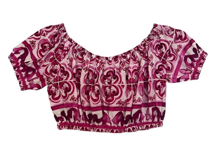 Off-shoulder 100% cotton crop top with magenta and white Italian porcelain majolica tile print and elastic trim.