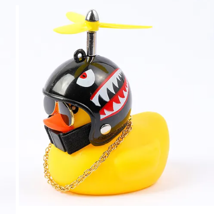 Yellow rubber duck with black helmet, yellow propeller, and gold chain, styled with shark teeth graphic.