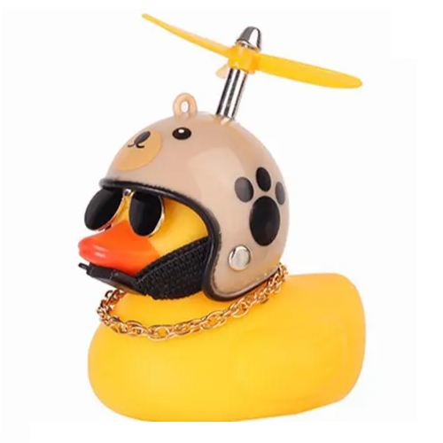 Yellow rubber duck with a beige bear helmet, sunglasses, and a gold chain, perfect for fun bath time adventures.