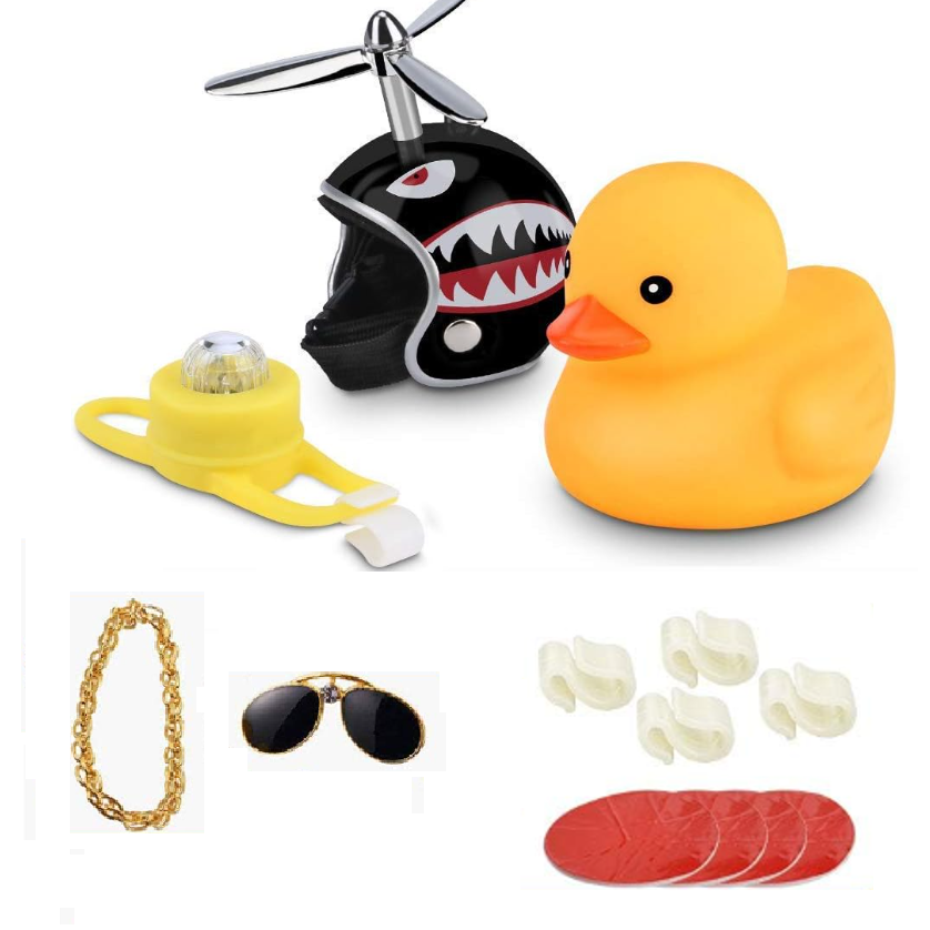 Colorful toy set featuring a black shark helmet, yellow rubber duck, gold chain, sunglasses, and assorted accessories.