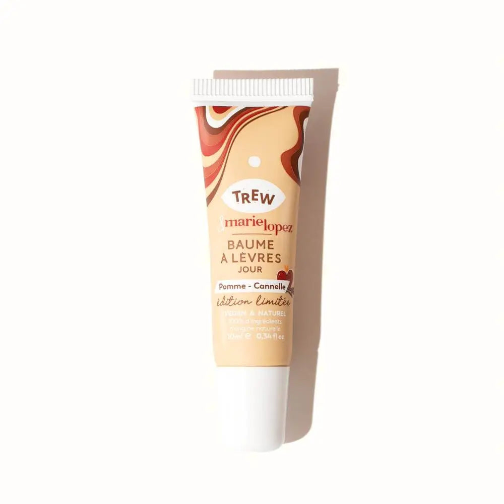 Squeeze tube of lip balm with beige packaging featuring a brown, red, and white swirl pattern at the top.