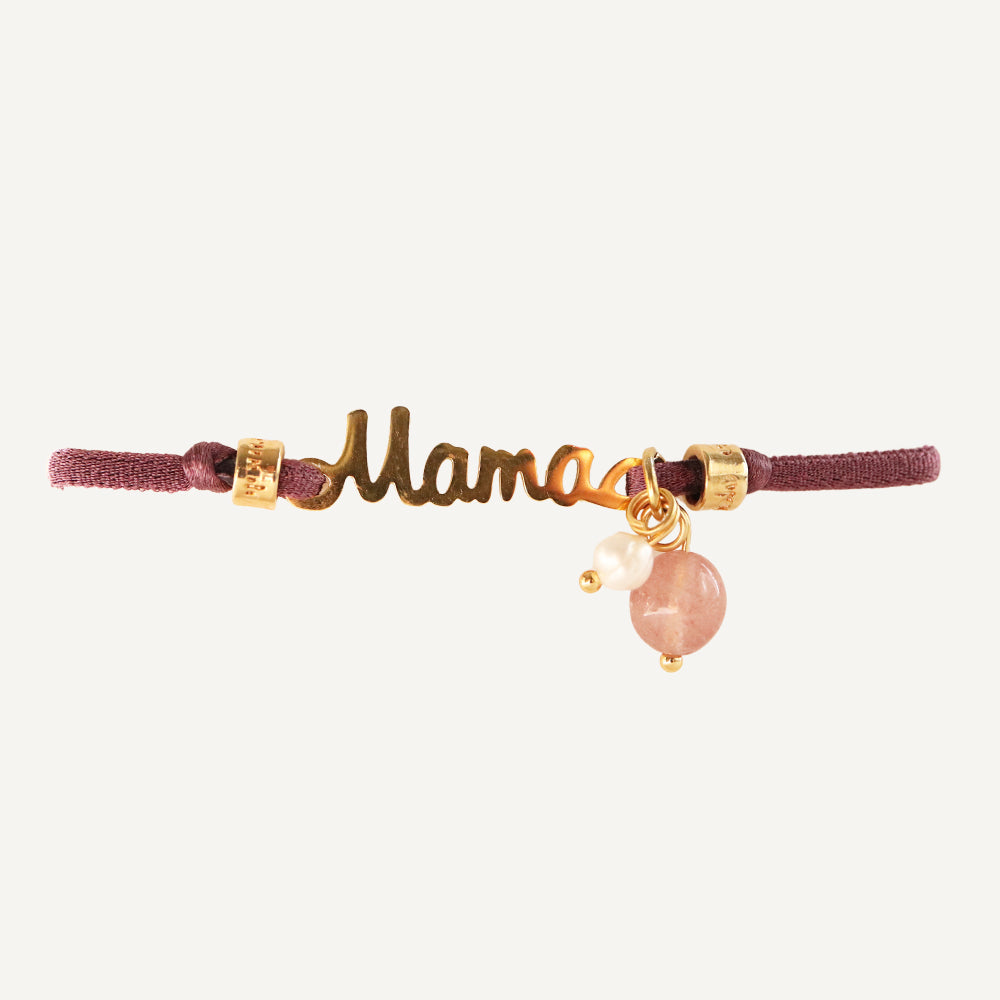 Pulsera "Mama" en dorado con cordón burdeos y charm de piedra rosa. Ideal como regalo especial.
