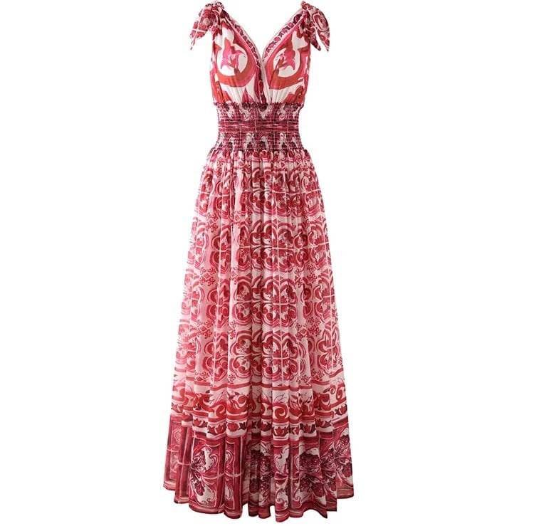 Pink patterned maxi dress with smocked bodice and tie straps, perfect for summer outings.