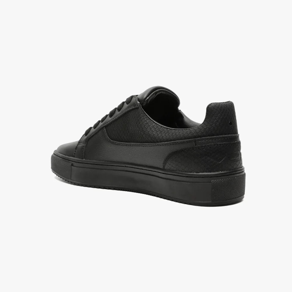 Baskets VO7 Roma Snake Dark : modèle bas noir en cuir avec texture serpent, lacets assortis et semelle épaisse.