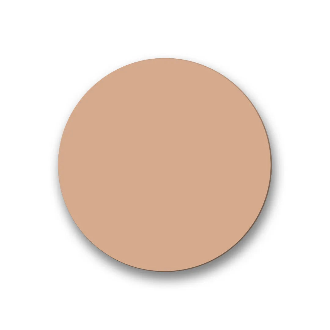 A smooth, round disk of light beige foundation or concealer cream with a matte texture, centered on a white background.