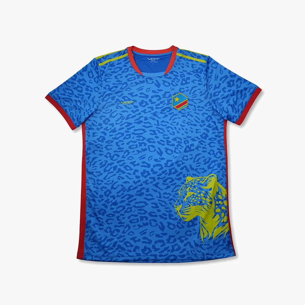 Maillot VO7 bleu à motif léopard avec logo, détails rouges, et tête de léopard jaune imprimée sur le bas.
