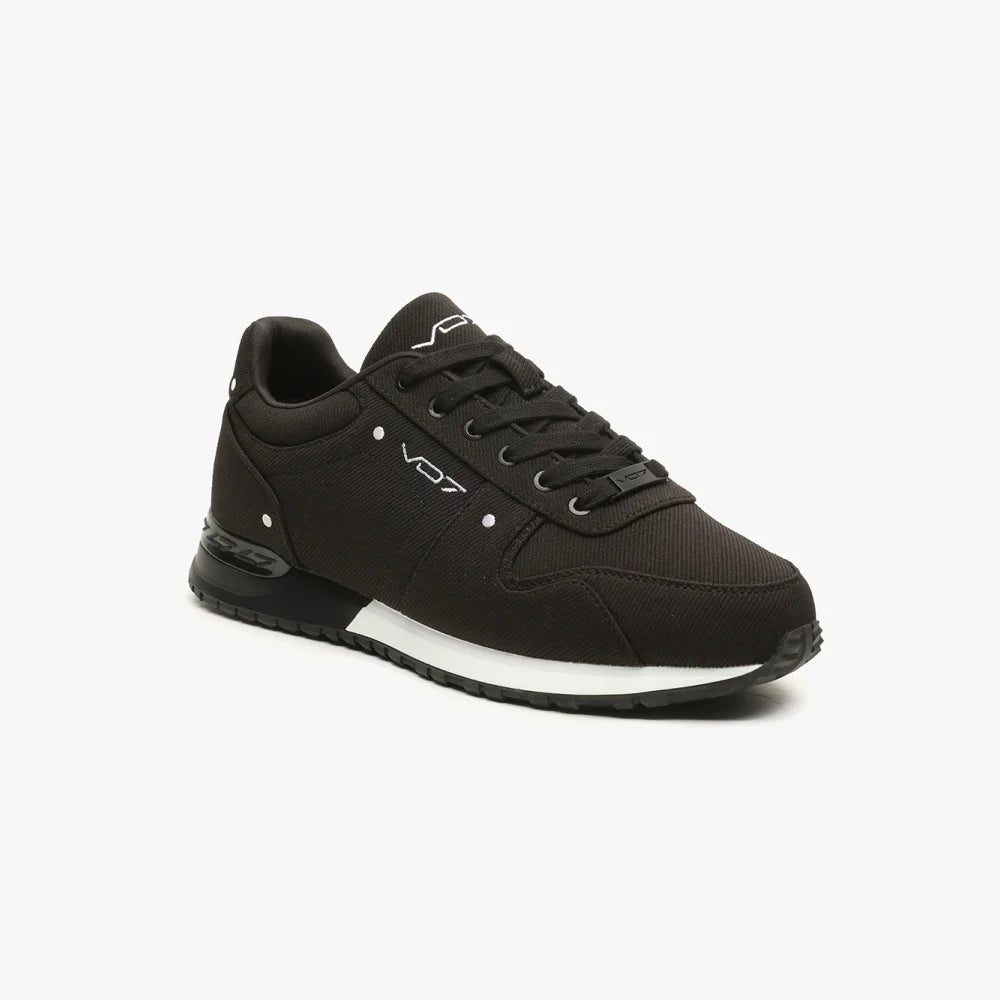 Baskets VO7 MILAN 10 noir en toile, avec semelle bicolore blanche et noire, logo contrasté et détails élégants.