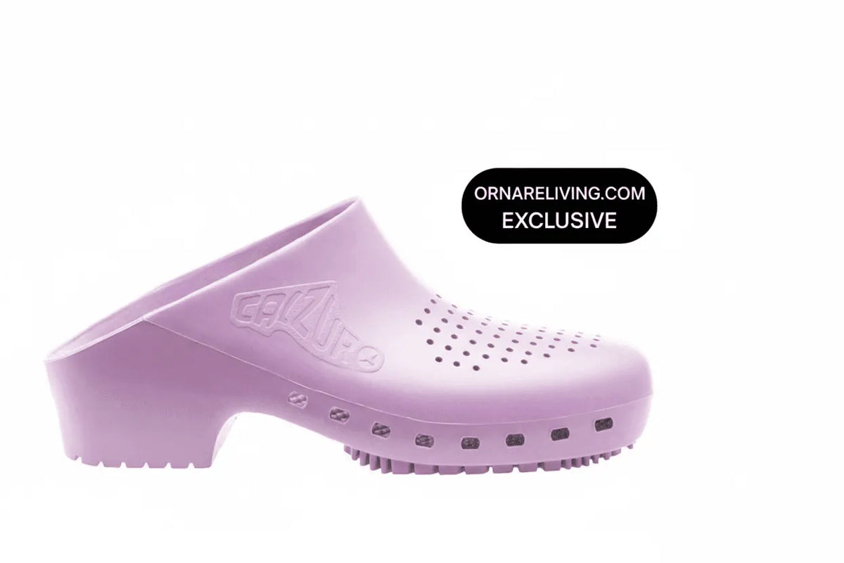 Lavender slip-on clog with a block heel, textured rubber sole, and perforated ventilation holes on the upper.